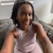 A smiling selfie of ebony pornstar Queen Ava Racks on the set of BlkTouch